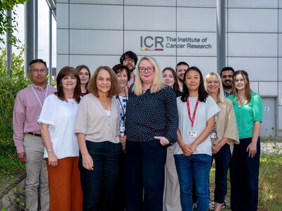 Team portraits of the Generations Study researchers, 13 people, stood outside the Sutton ICR. With Montse and Amy at the front.
