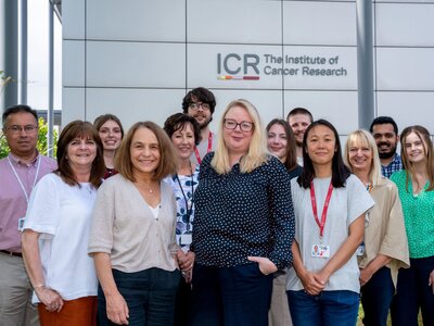 Team portraits of the Generations Study researchers, 13 people, stood outside the Sutton ICR. With Montse and Amy at the front.