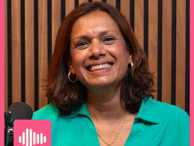 Pretti, with gold hoop earrings and a turquoise top, smiling at the camera