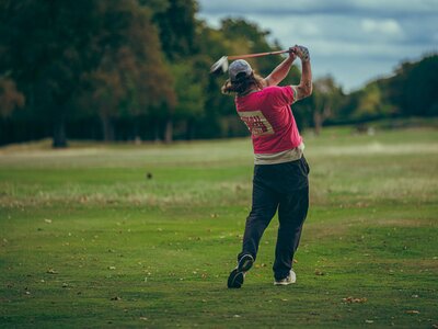 Images of people playing golf.