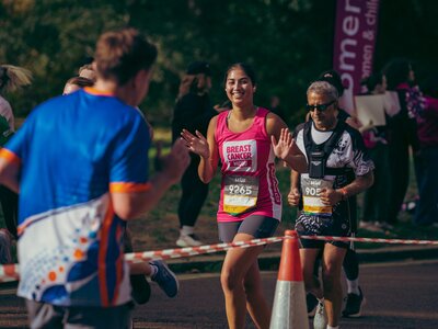 Breast Cancer Now runners at the Royal Parks half marathon 2026 and the Breast Cancer Now cheerpoint. 