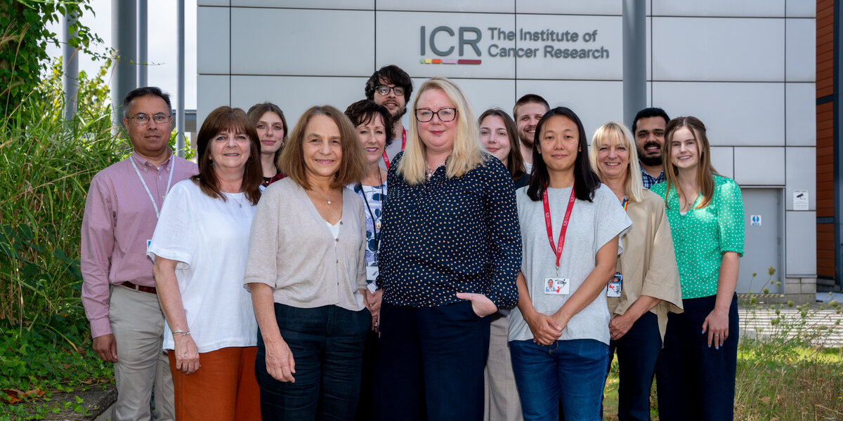 Team portraits of the Generations Study researchers, 13 people, stood outside the Sutton ICR. With Montse and Amy at the front.