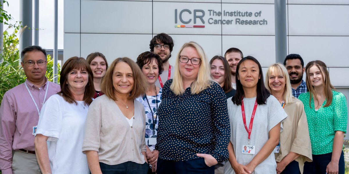 Team portraits of the Generations Study researchers, 13 people, stood outside the Sutton ICR. With Montse and Amy at the front.