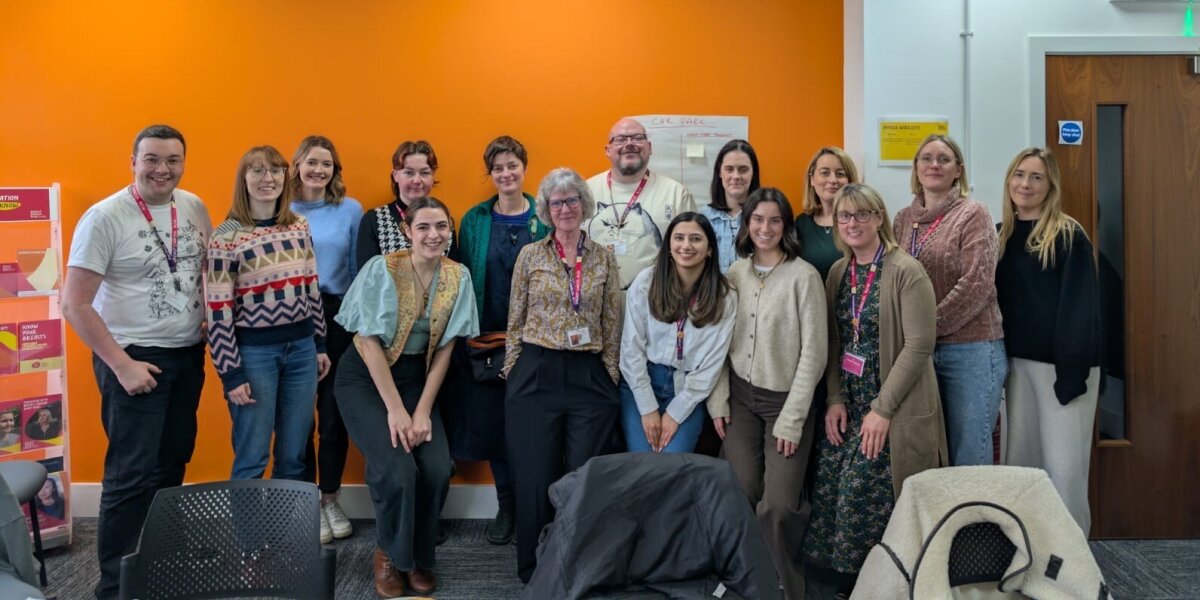 Group photo of Breast Cancer Now's Living with Secondary Breast Cancer team in an office.
