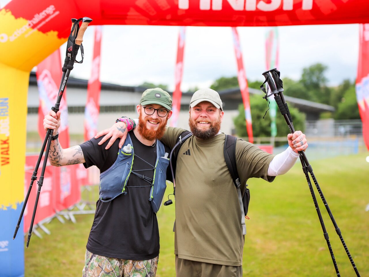 A photo of 2 men celebrating at the finish line of the Chiltern 50 challenge.