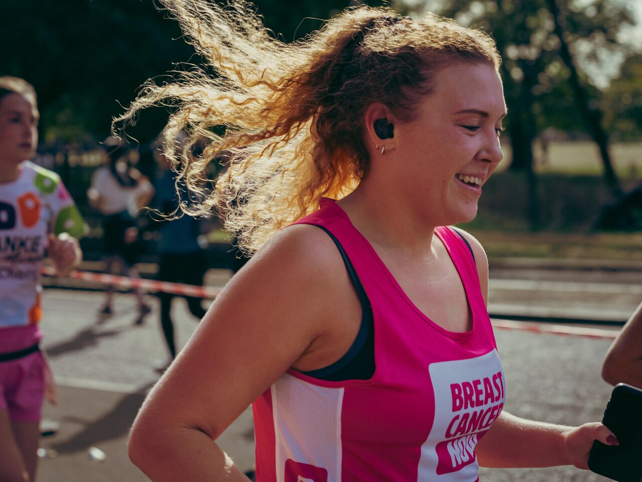 Breast Cancer Now runners at the Royal Parks half marathon 2026 and the Breast Cancer Now cheerpoint. 