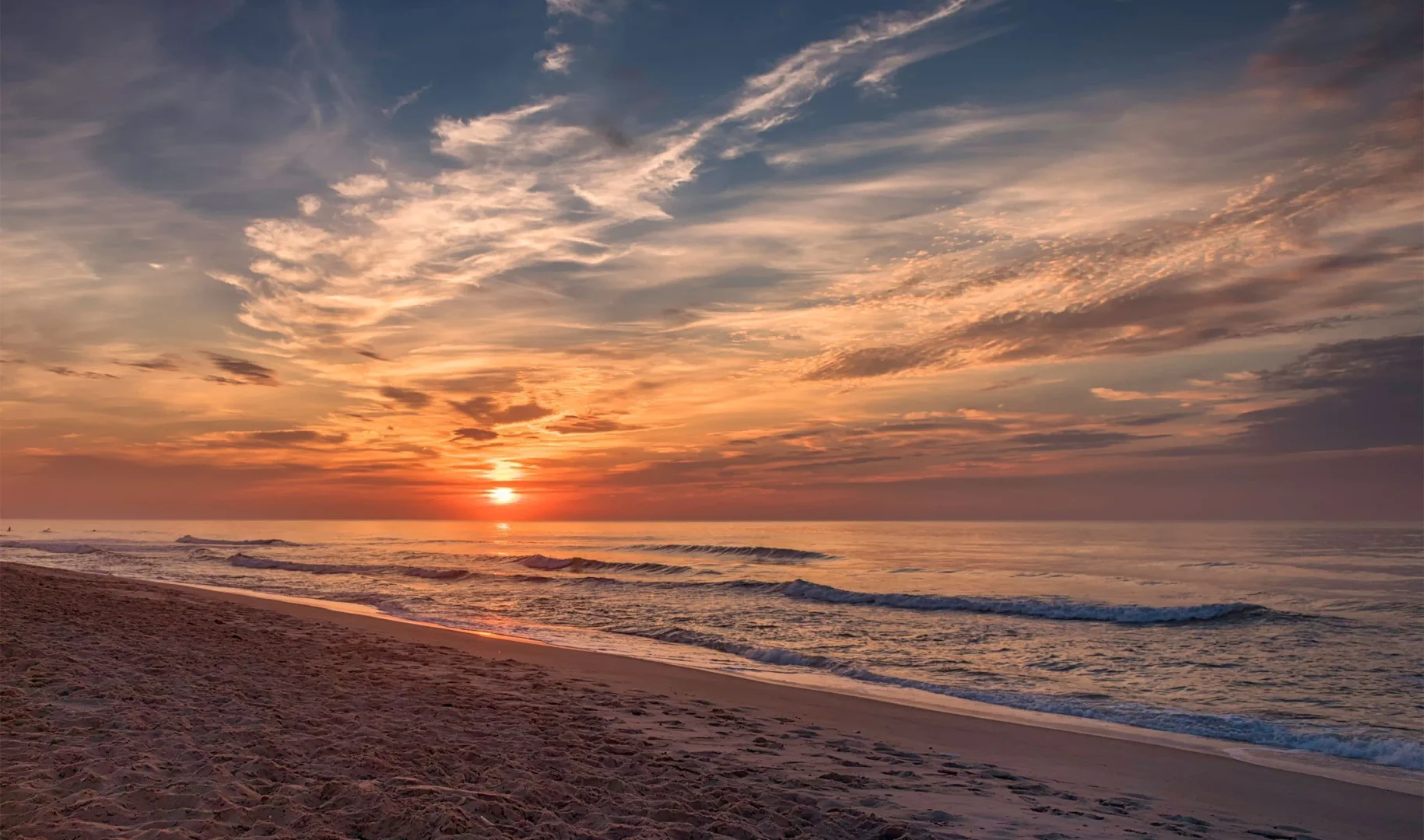 Sunset over ocean shoreline